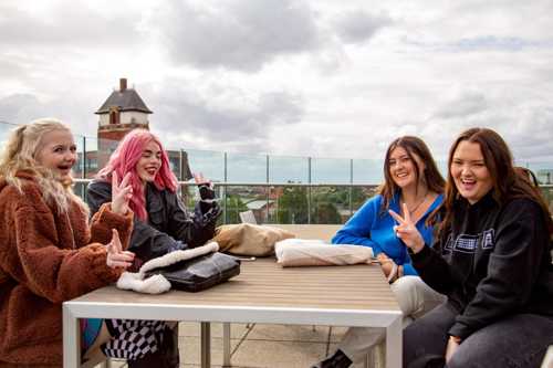 Students enjoying the open air space on the Vijay Terrace.